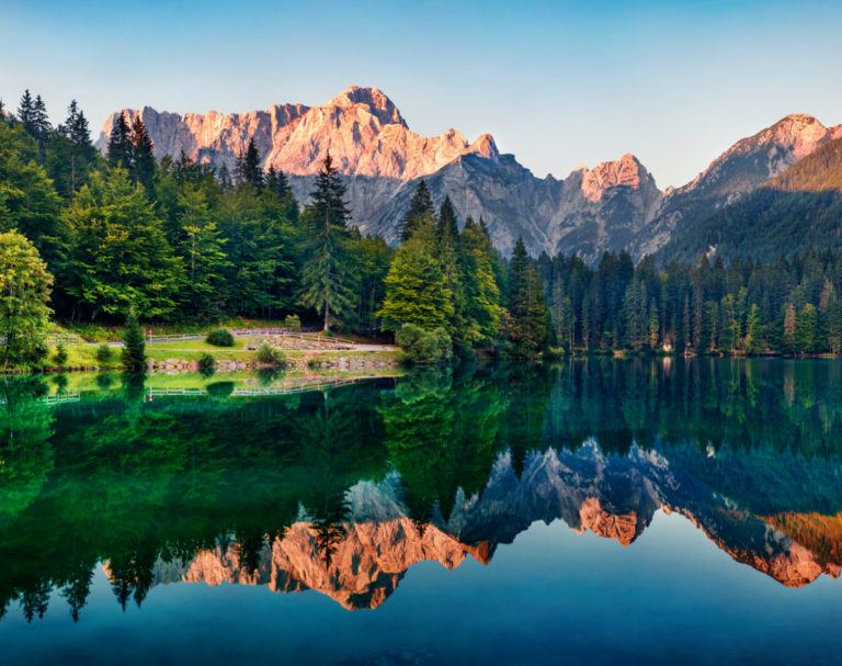 Mountains and trees reflected in lake